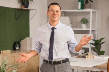 Portrait of handsome businessman in office