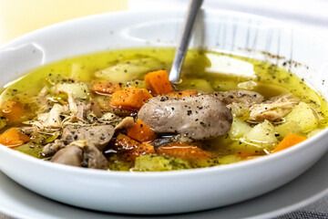 Hearty and nutritious food, chicken soup with vegetables. Real low carb food