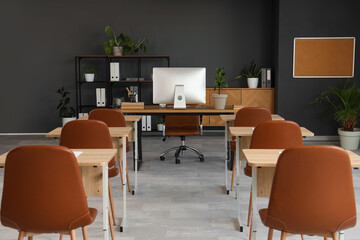Interior of modern stylish empty classroom prepared for exam