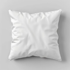 Obraz premium A White Pillow with Subtle Wrinkles on a Gray Background