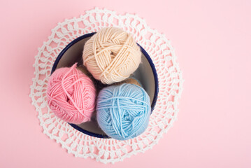 Pastel color yarn balls in bowl