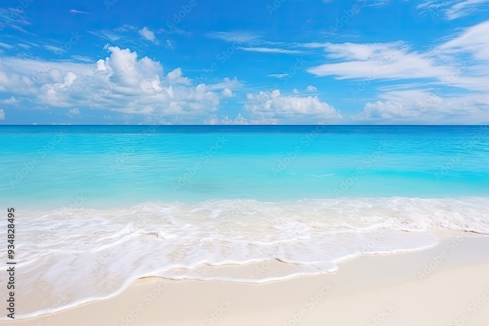 Wall mural White clouds floating above the azure sea, blending into the blue sky. Tropical beach with white sand and clear aqua waters of the Caribbean coast.