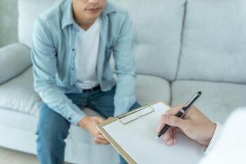 man with mental health problems is consulting. psychiatrist is recording the patient's condition for treatment. encouragement, love and family problem, bipolar , depression patient, protect suicide.