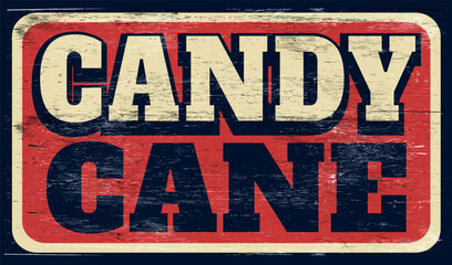 Aged retro candy cane sign on wood