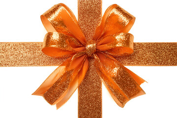 Golden sparkling holiday bow with ribbon on white background