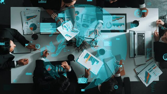 Top down aerial view of skilled businessman pointing communication strategy at whiteboard while investor listening presentation and analyze database connection graph at meeting table. Directorate.