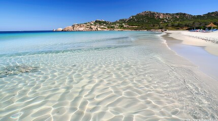A serene beach featuring white sand and clear blue waters offers a peaceful escape from the hustle and bustle of daily life