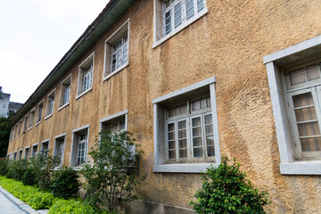 Facade of old yellow factory building