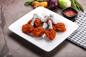 Indian cuisine glazed chicken lollipop