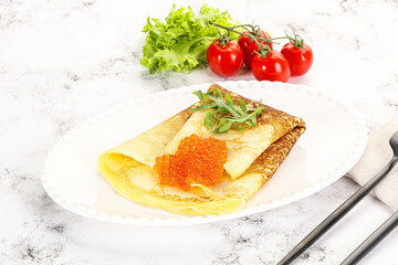 Russian pancake with red caviar