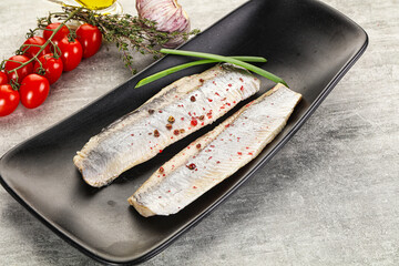 Marinated herring fillet with green onion