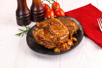 Italian cuisine - ossobuco with sauce