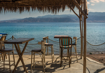 Fragment of coffee shop on sandy beach of the Red Sea