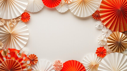 white background surrounded by Japanese red, white, and gold paper fans arranged as a frame