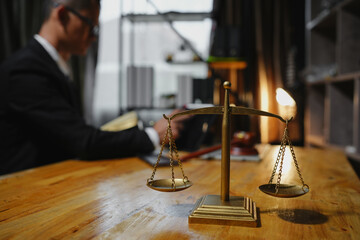 Male lawyer sitting and working, solving problems and work related to the legal work of lawyers.