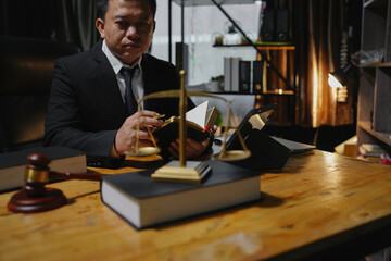 Male lawyer sitting and working, solving problems and work related to the legal work of lawyers.