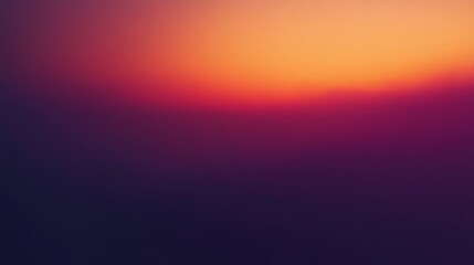 A vibrant sunset blending hues of orange, purple, and blue, creating a peaceful and tranquil atmosphere in nature.