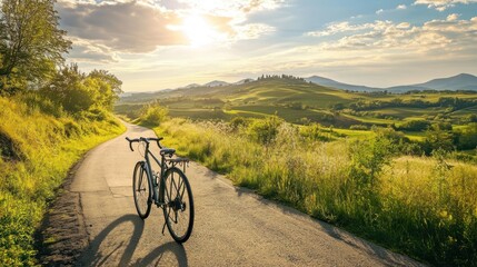 Obraz premium Cycling Through Rolling Hills at Sunset