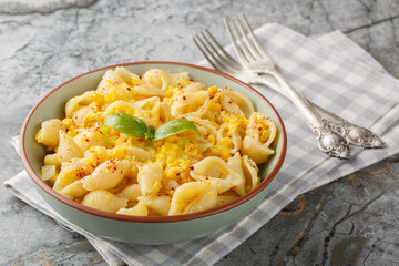 Creamy corn pasta with fresh basil is a bright meatless meal that's fast, simple, and makes the best effortless summer dinner closeup in the bowl on the table. Horizontal