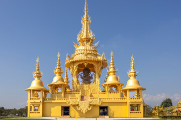 The bright golden castle of Wat Rong Khun This temple stands out because of its pure white color. Contrasting with the glittering gold color of the intricately decorated patterns. It is a famous templ