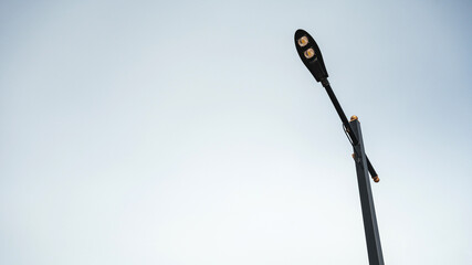 Light pole on the sky background