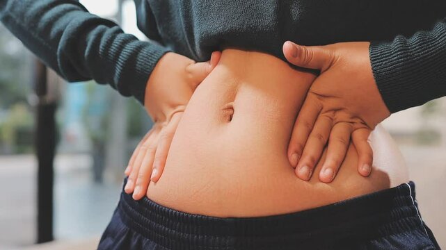 fat woman, fat belly, chubby, obese woman hand holding excessive belly fat with measure tape, woman diet lifestyle concept