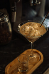 Ice cream with coffee and sugar syrup in a glass.