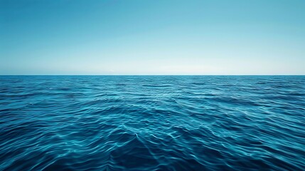 Obraz premium Calm, pale blue sea with a clear sky section for text