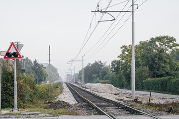 Fresh track and ballast on a track bed at a renovation works of a railway track. Morning view of a railway line that is being renovated
