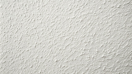 Fototapeta premium A light-colored wall displays an interesting textured pattern, adding depth to the interior space. The natural light enhances the wall's features, creating a warm atmosphere