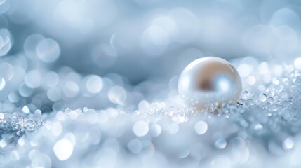  A tight shot of a pearl nestled in a blue-and-white textured bokeh