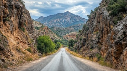 Naklejka premium photo of a narrow asphalt road in a mountainous area.