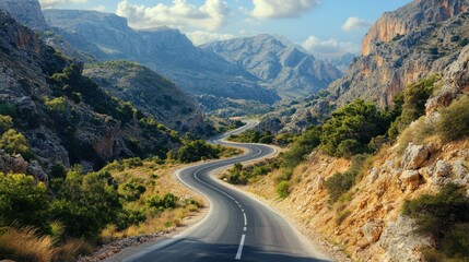 photo of a narrow asphalt road in a mountainous area.