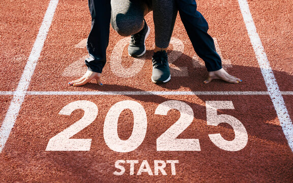 New year resolution 2025 concept. Word start 2025 written on athletics track and athlete woman runner preparing for new year for challenge and change. planning health and the goal to success