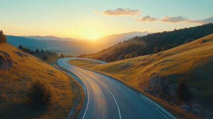 road in mountainous area at sunset. View from above