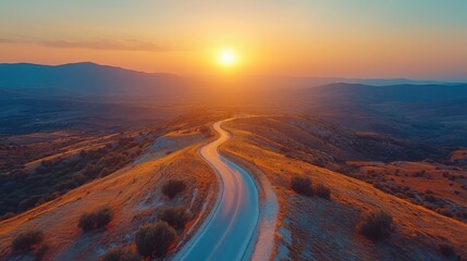road in mountainous area at sunset. View from above