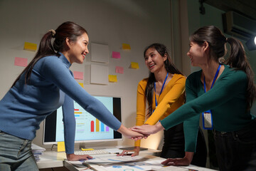 Fototapeta premium Business teamwork holding hands concept Business team joining hands Participate in business work with successful new startup projects.