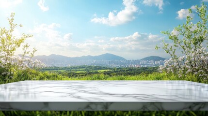 Fototapeta premium White marble table with clear blue sky,surrounded by green fields,city buildings in the horizon,city view with nature,view of window wall building with city view background,Modern office interior.