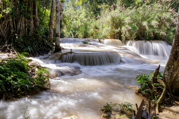 Huai Mae Khamin Waterfall The clear, clean water flows cool and refreshing amidst the lush green forest. The water flows down in layers. Create a feeling of freshness and relaxation.