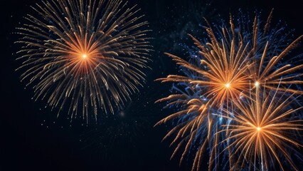 Fototapeta premium Big fireworks on a dark blue night background from the starry sky on New Year's Eve