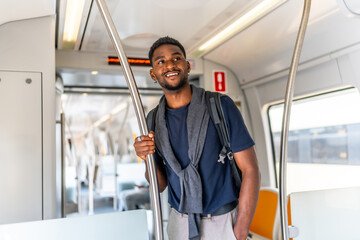 Casual african businessman travelling by metro in the city