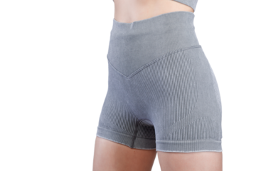 Sports jacket of grey color, women's sports suit seamless, jacket for yoga training on a girl on an isolated white background close-up