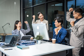 Asian colleagues meet at a desk, discussing business financial terms, investment strategies,...