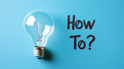 "How To?" with light bulb as a symbol of inspiration
