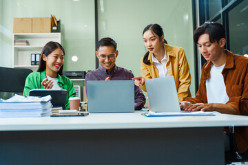 In a boardroom, an Asian team discusses startup financials and business terms. They present strategies on acquisitions, cash flow, and investor relations, innovative approaches for company growth.