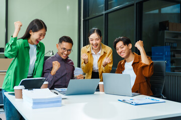 In a boardroom, an Asian team discusses startup financials and business terms. They present strategies on acquisitions, cash flow, and investor relations, innovative approaches for company growth.