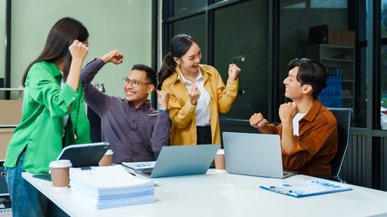 In a boardroom, an Asian team discusses startup financials and business terms. They present strategies on acquisitions, cash flow, and investor relations, innovative approaches for company growth.