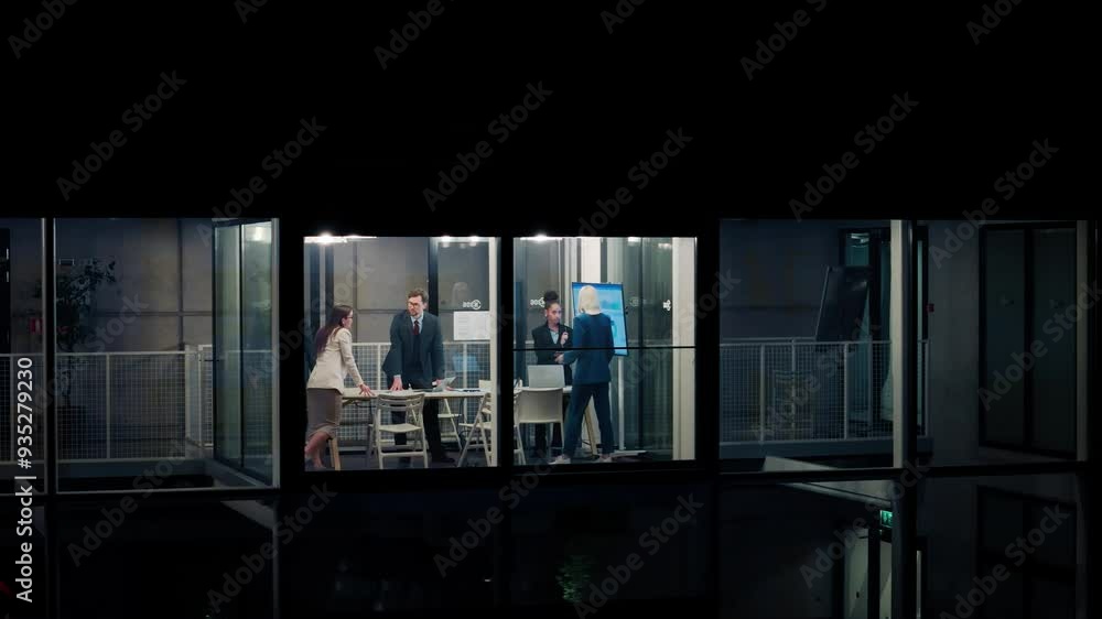 Poster manager walking into a room with a team working on market research in the evening. professionals hav