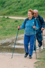 senior couple hiking outdoors in nature