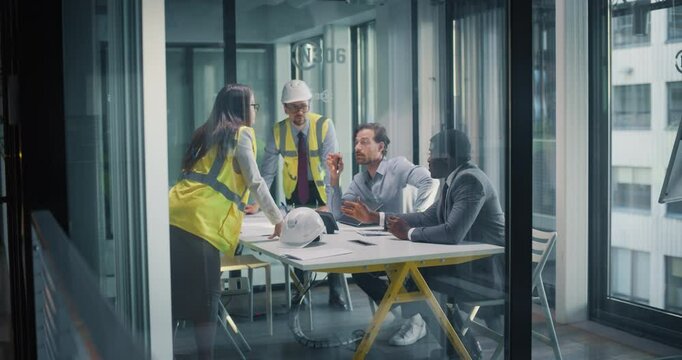 Meeting in Real Estate Development Firm: Investment Strategist and a Financial Advisor Having a Conversation with Architect and a Civil Engineer About a New Construction Project in Financial District